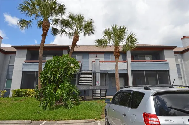 an aerial view of a house with a lake view