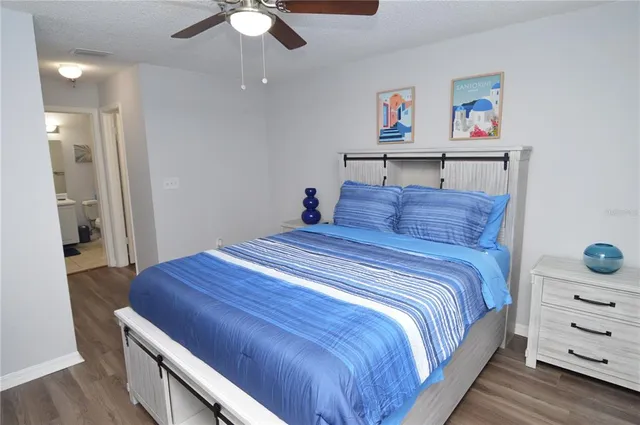 a bathroom with a toilet and a mirror