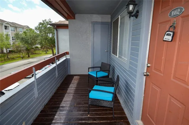 a kitchen with a sink a stove a microwave and refrigerator