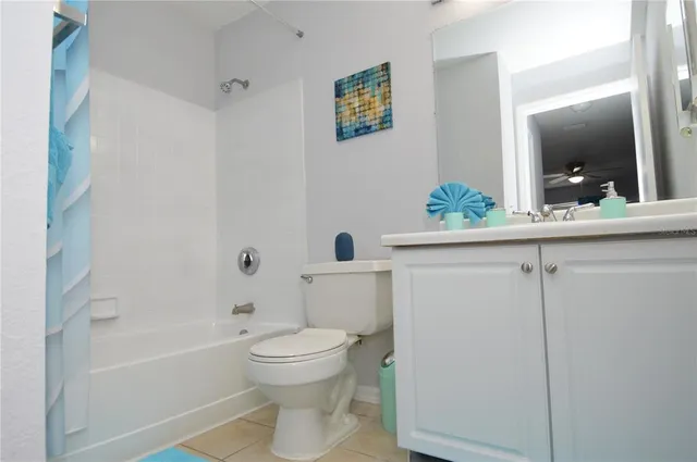 a view of a patio with a table and chairs under an umbrella