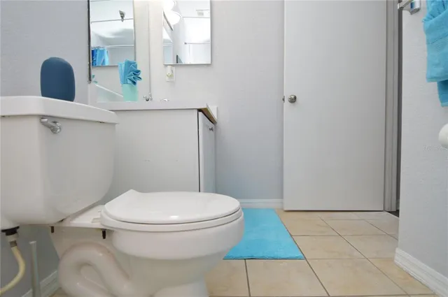 a view of a lake with a floor to ceiling window next to a lake