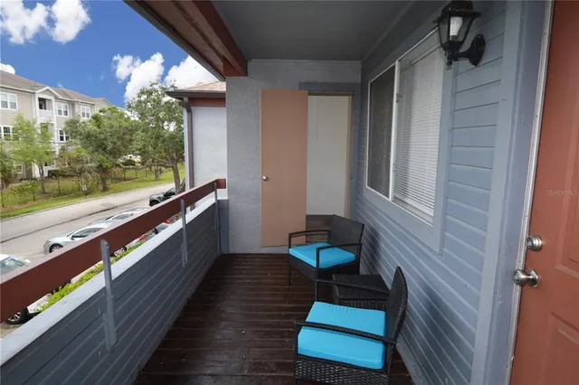 a view of a lake with houses in the background