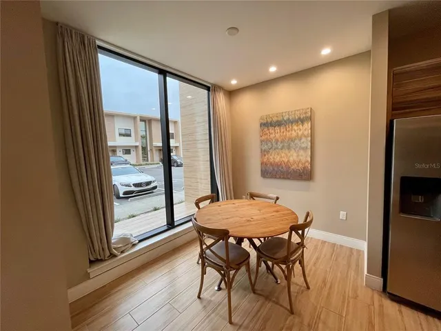 a kitchen with a table and chairs in it