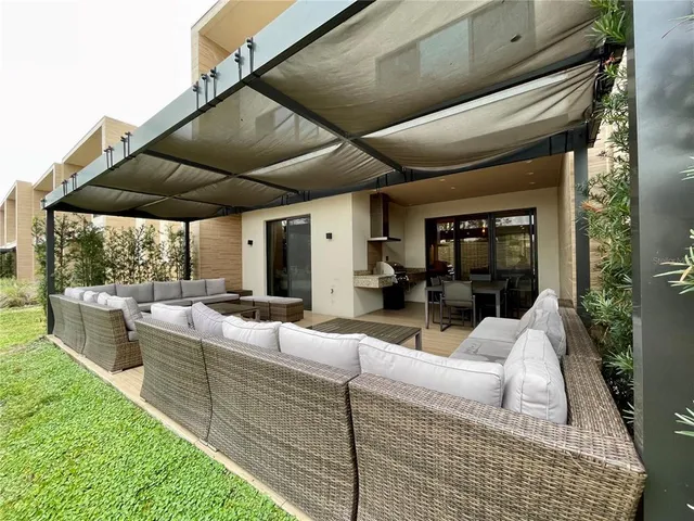a view of living room kitchen with patio