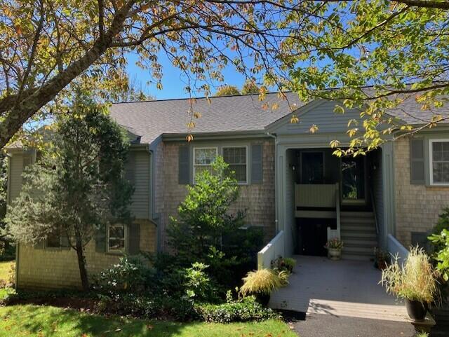 407 Orleans Road, Unit B Chatham, MA 02650 - Photo 2 of 16 front view of a house with a garden
