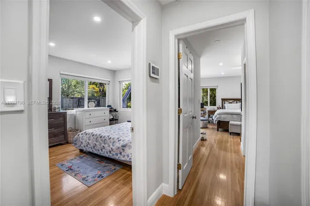 a en suite bathroom with a tub shower and bedroom view