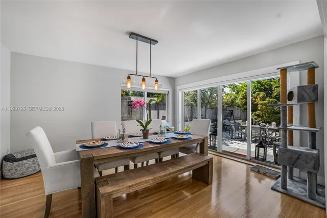 a view of a dining room with furniture window and outside view