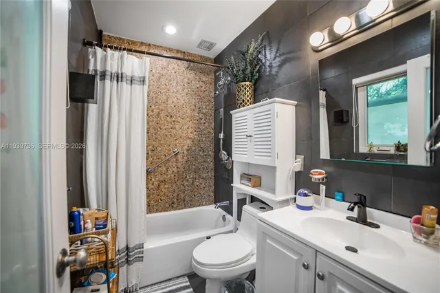 a kitchen with a sink cabinets and window