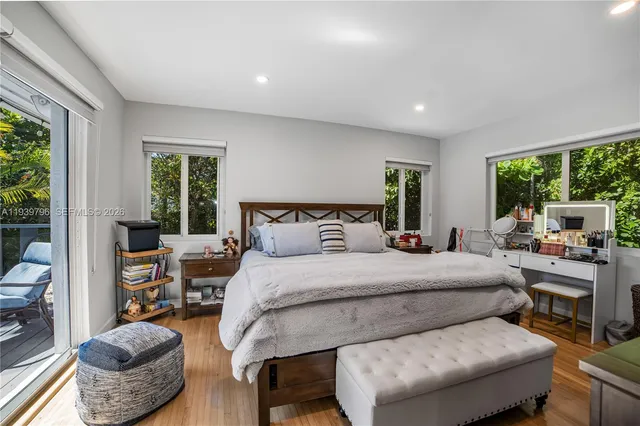 a bedroom with a bed and a couch