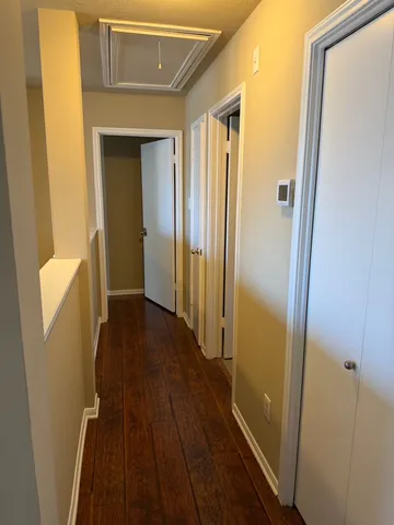 a bathroom with a granite countertop sink a mirror and a window