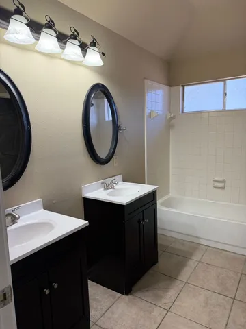 a view of a bathroom from a hallway