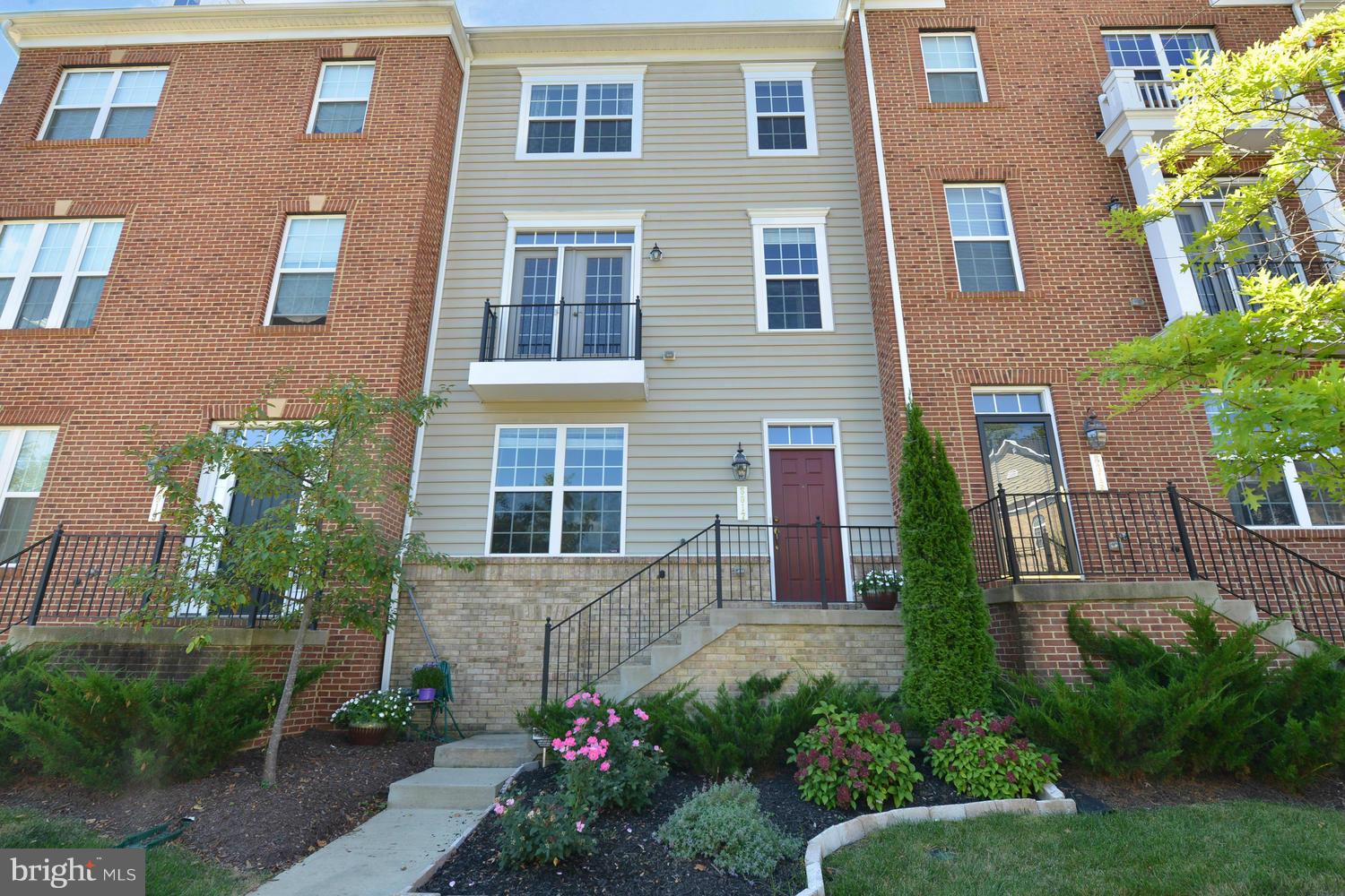 a view of a brick building next to a yard