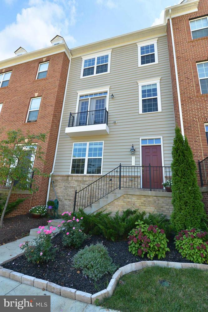 8017 Sport View Road Landover, MD 20785 - Photo 2 of 30 a front view of a house with a yard and outdoor seating