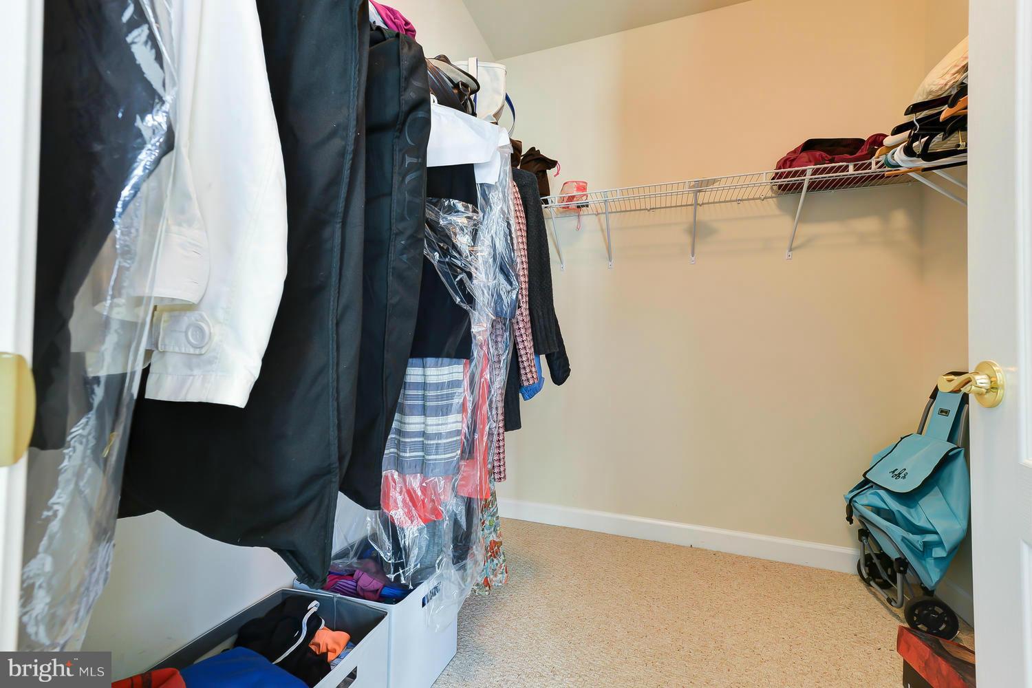 8017 Sport View Road Landover, MD 20785 - Photo 17 of 30 a view of walk in closet with clothes and shoes