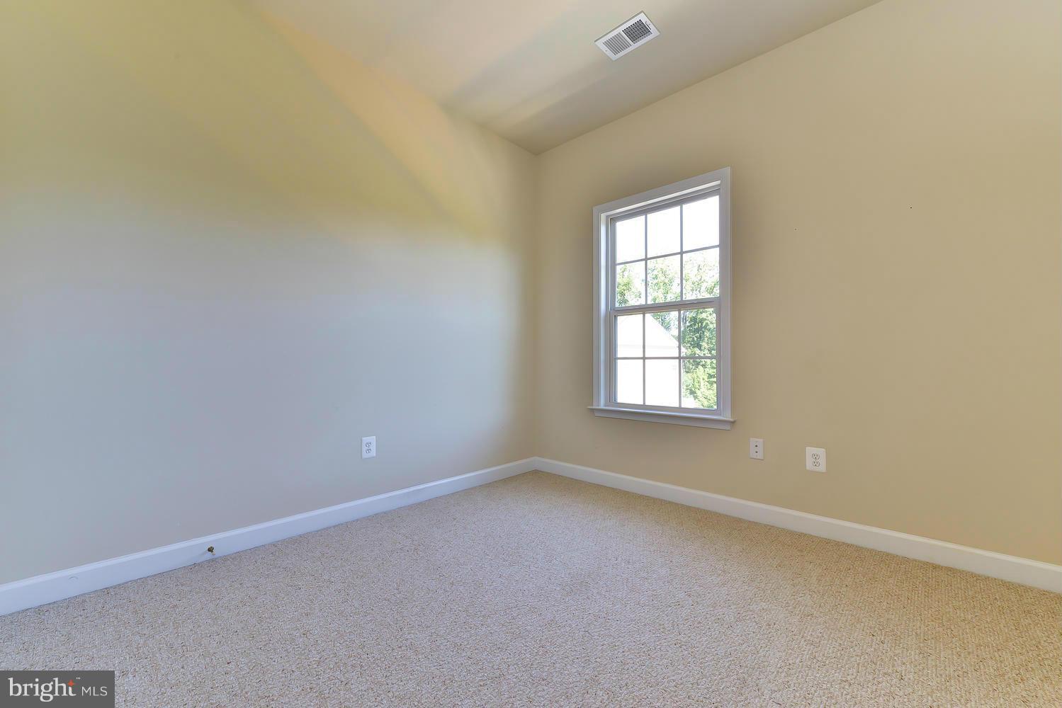 8017 Sport View Road Landover, MD 20785 - Photo 20 of 30 an empty room with a window
