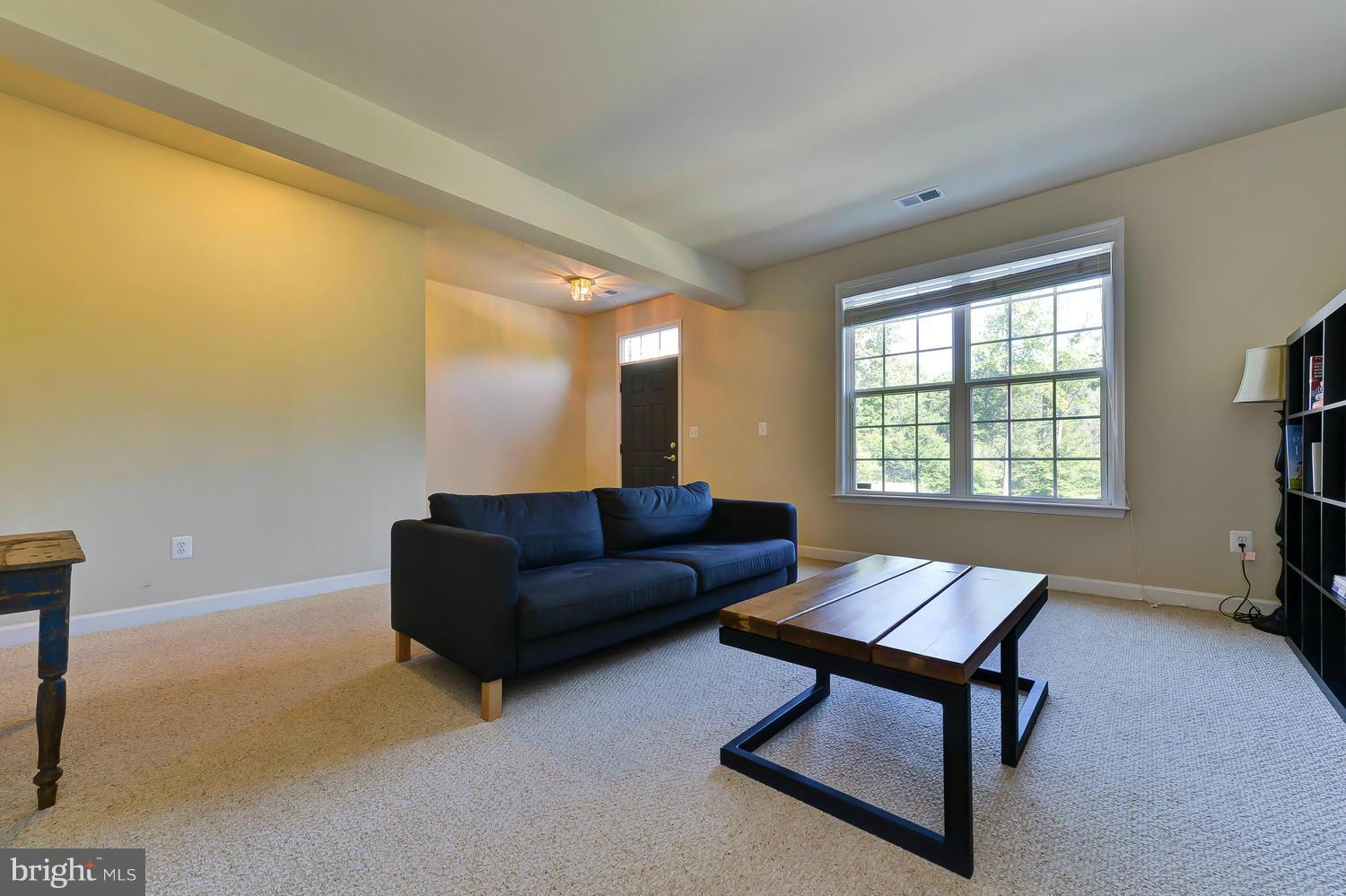 8017 Sport View Road Landover, MD 20785 - Photo 21 of 30 a living room with furniture and a window