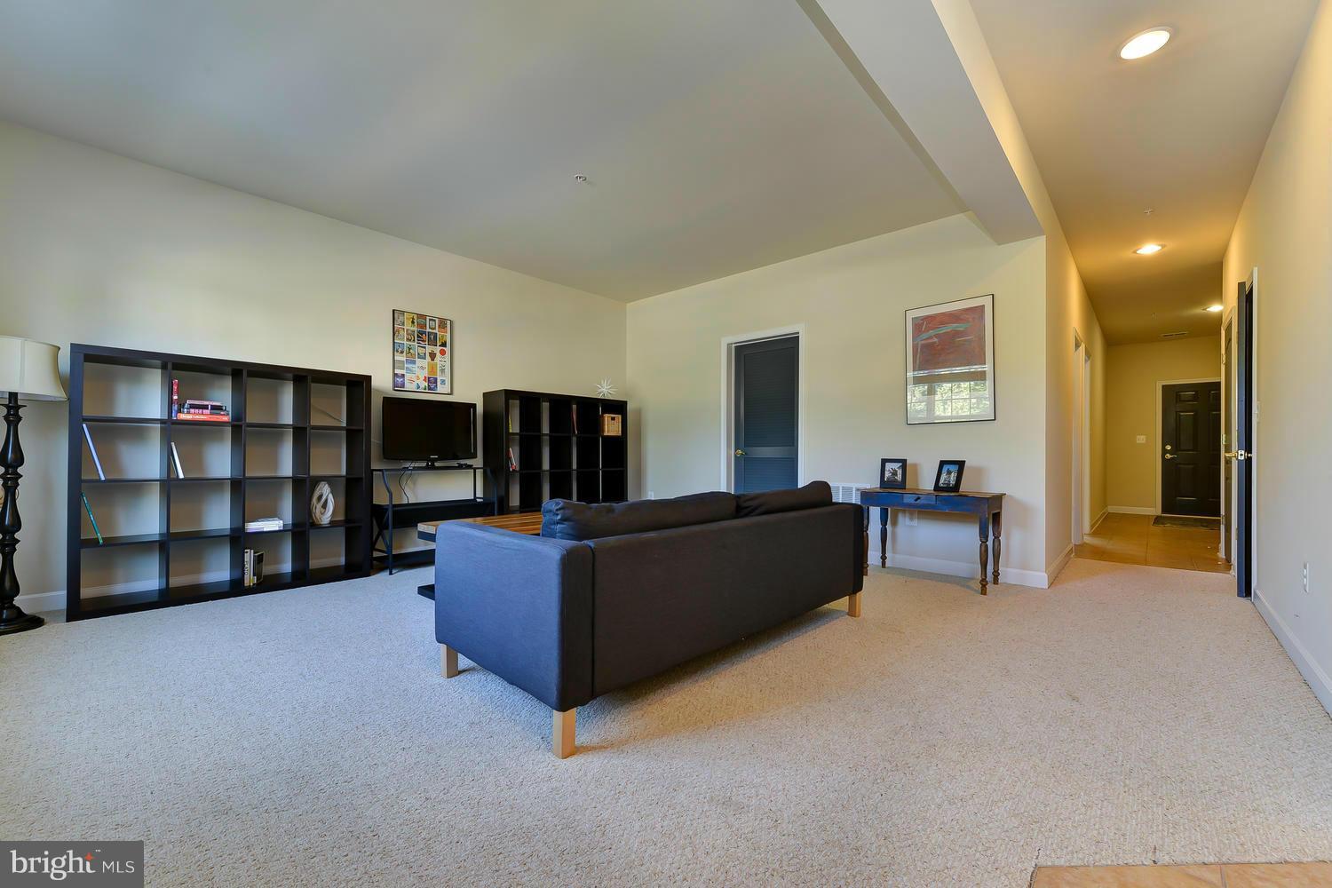 8017 Sport View Road Landover, MD 20785 - Photo 22 of 30 a living room with furniture and a flat screen tv