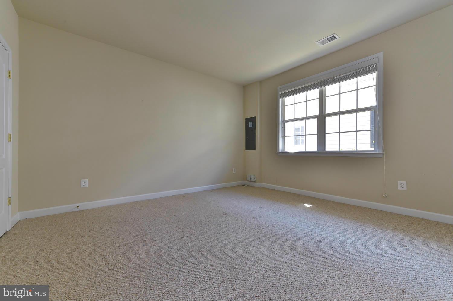 8017 Sport View Road Landover, MD 20785 - Photo 23 of 30 an empty room with a window