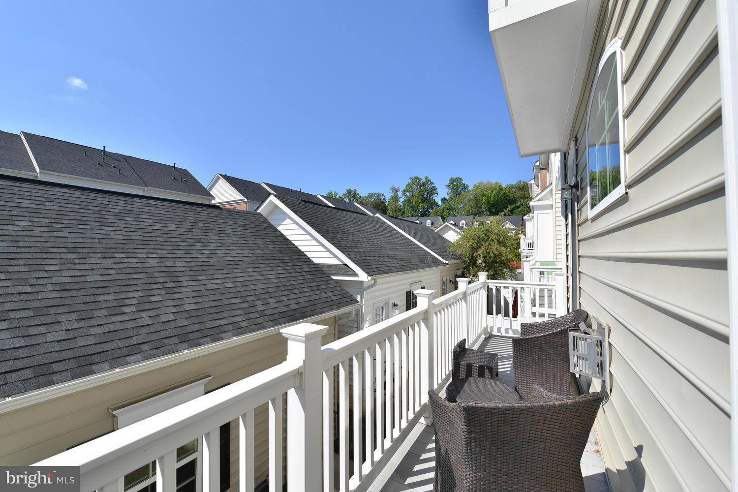 8017 Sport View Road Landover, MD 20785 - Photo 28 of 30 a view of a balcony with wooden fence and floor