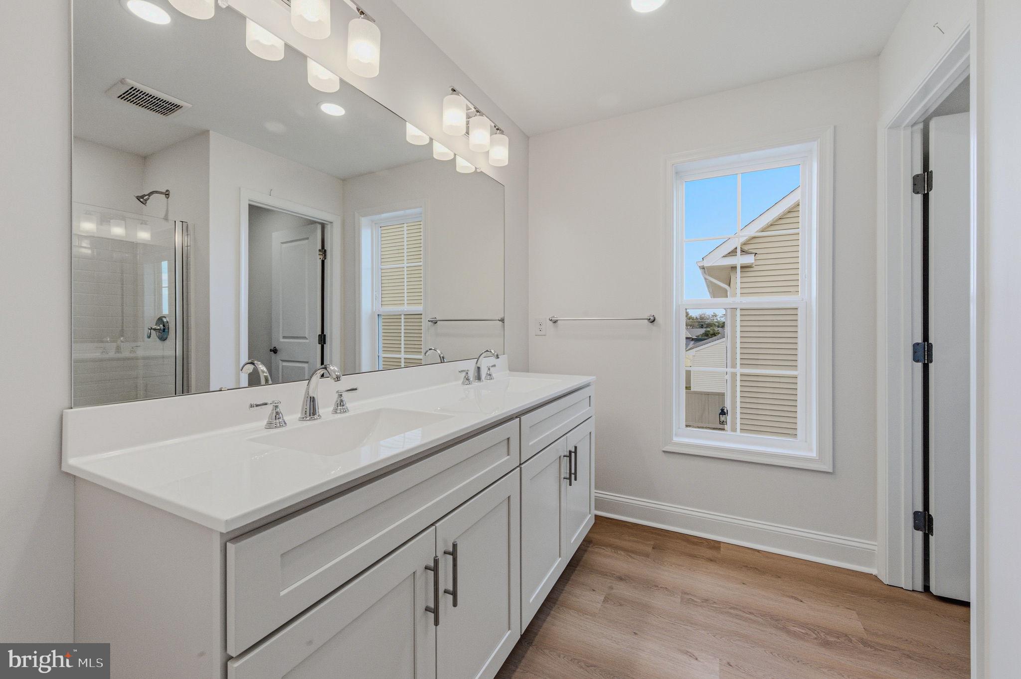 2503 A Duncan Road Wilmington, DE 19808 - Photo 34 of 39 a bathroom with a sink double vanity and a mirror