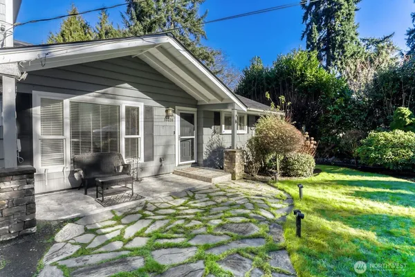 a view of a house with backyard porch and sitting area