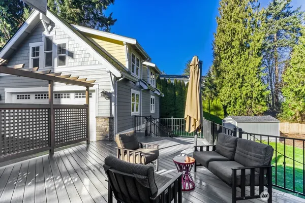 a view of a house with a yard porch and sitting area