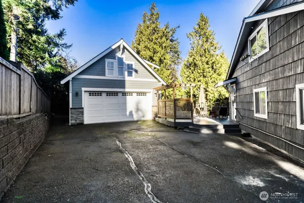 a view of a house with a yard and garage