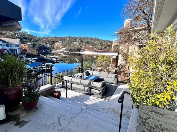 a view of a chairs and table in patio