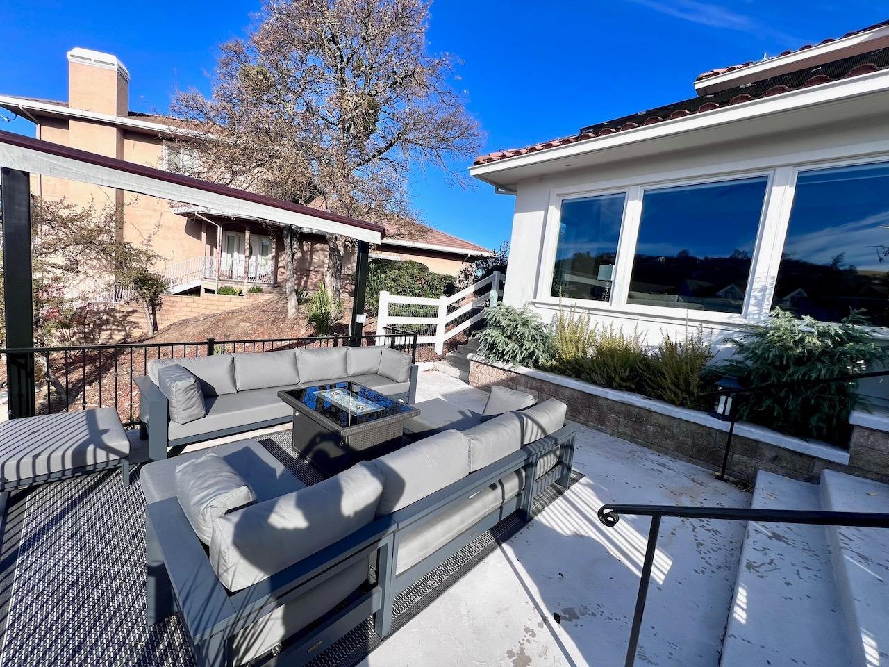 5 Paseo Delago Copperopolis, CA 95228 - Photo 32 of 39 a view of a patio with couches table and chairs with wooden floor
