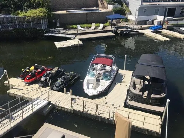 a view of a lake with sitting area