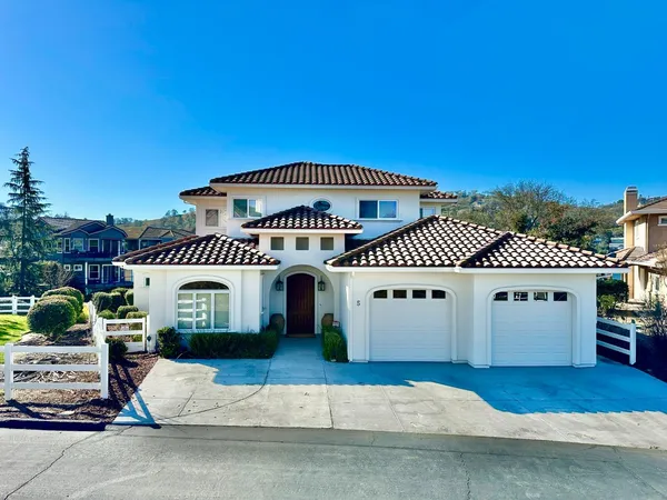 a front view of a house with a garage
