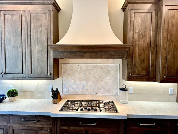 a kitchen with a stove and a refrigerator