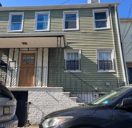 a front view of a house with a garage