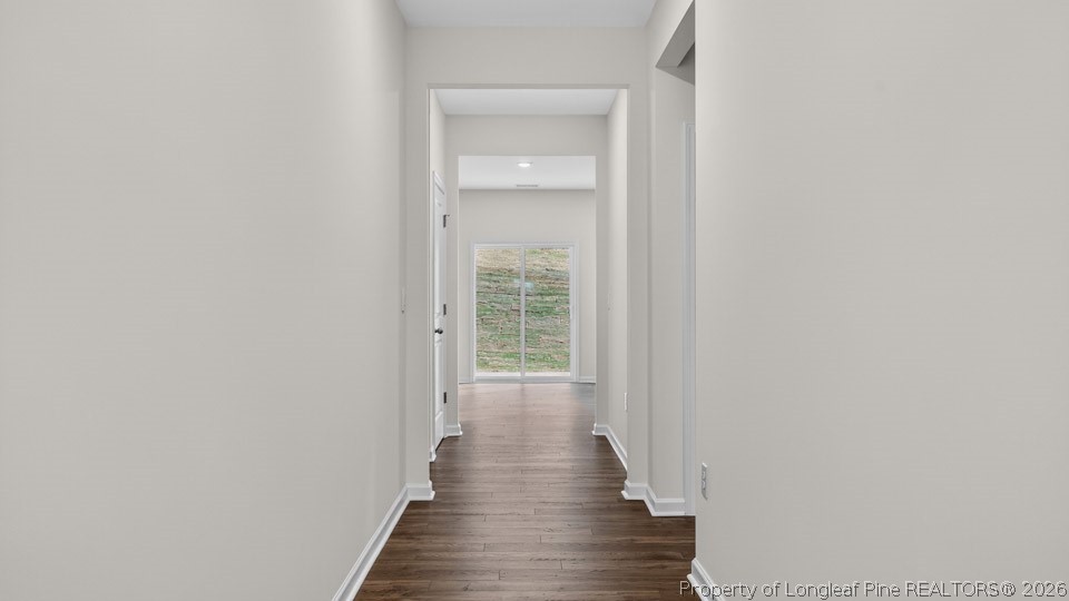 36 Firehawk Drive Spring Lake, NC 28390 - Photo 3 of 38 a view of a hallway with wooden floor