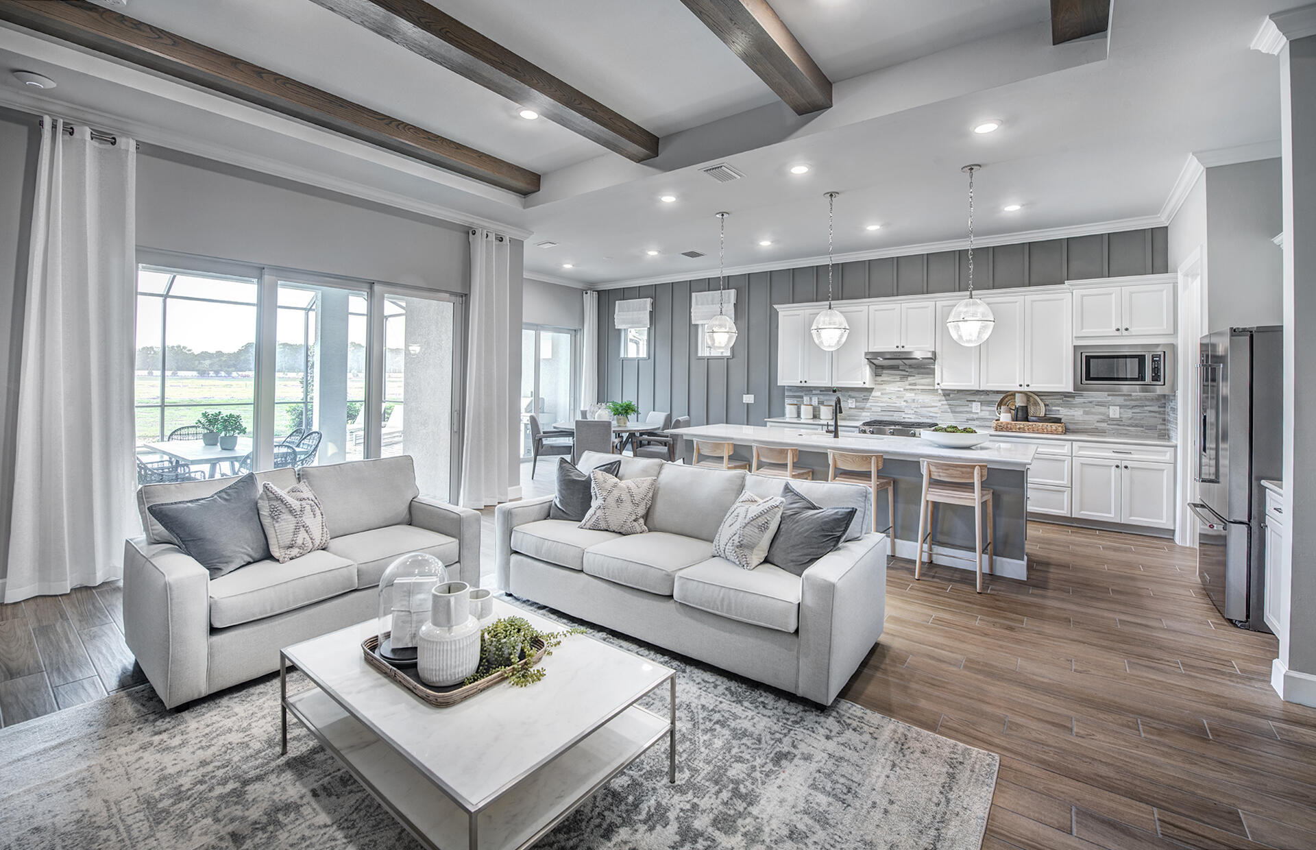 10361 Southwest Highpointe Drive, Unit PRESTIGE 268 Stuart, FL 34997 - Photo 3 of 24 a living room with furniture and kitchen view