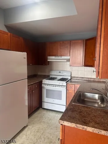 a bathroom with a sink a toilet and tub