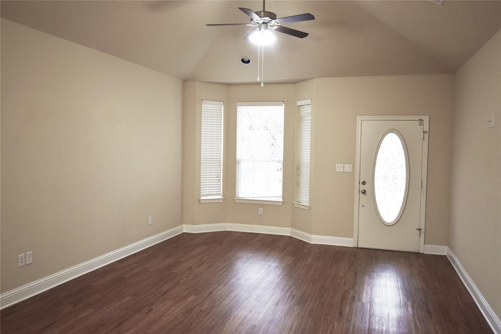 3901 Montecito Drive, Unit 2016 Denton, TX 76210 - Photo 2 of 15 The living room ebtry area features a bay window