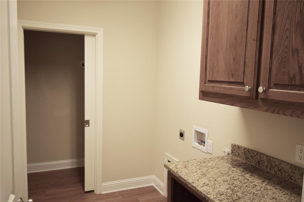 3901 Montecito Drive, Unit 2016 Denton, TX 76210 - Photo 9 of 15 The laundry room includes a folding area.