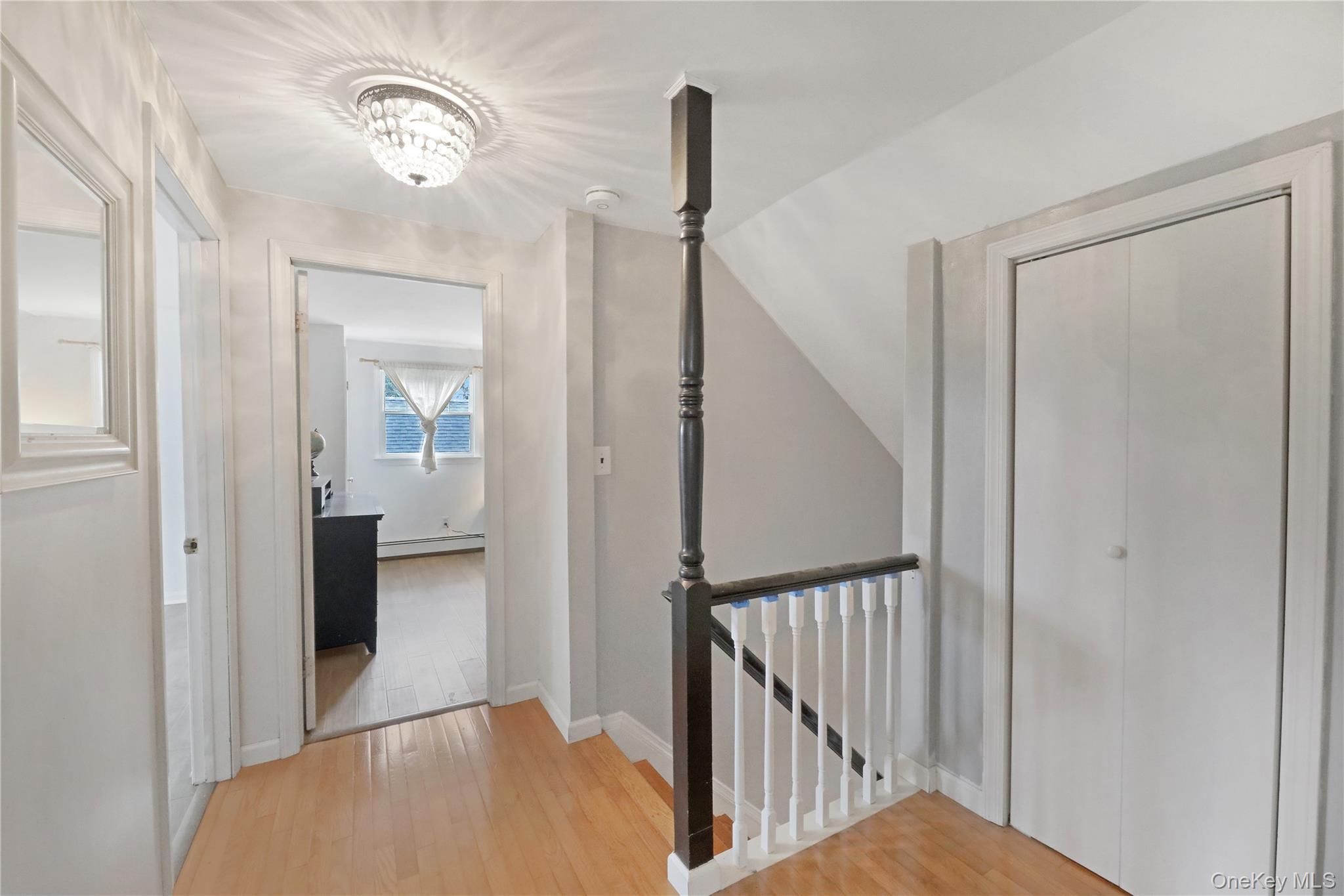 48 Nidzyn Avenue Remsenburg, NY 11960 - Photo 27 of 43 a view of a hallway with windows and stairs