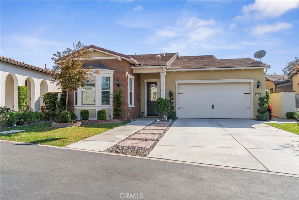 3740 East Glorietta Brea, CA 92823 - Photo 1 of 40 a view of a white house with a big yard and large tree and plants