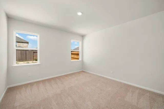 a view of an empty room with a bathroom