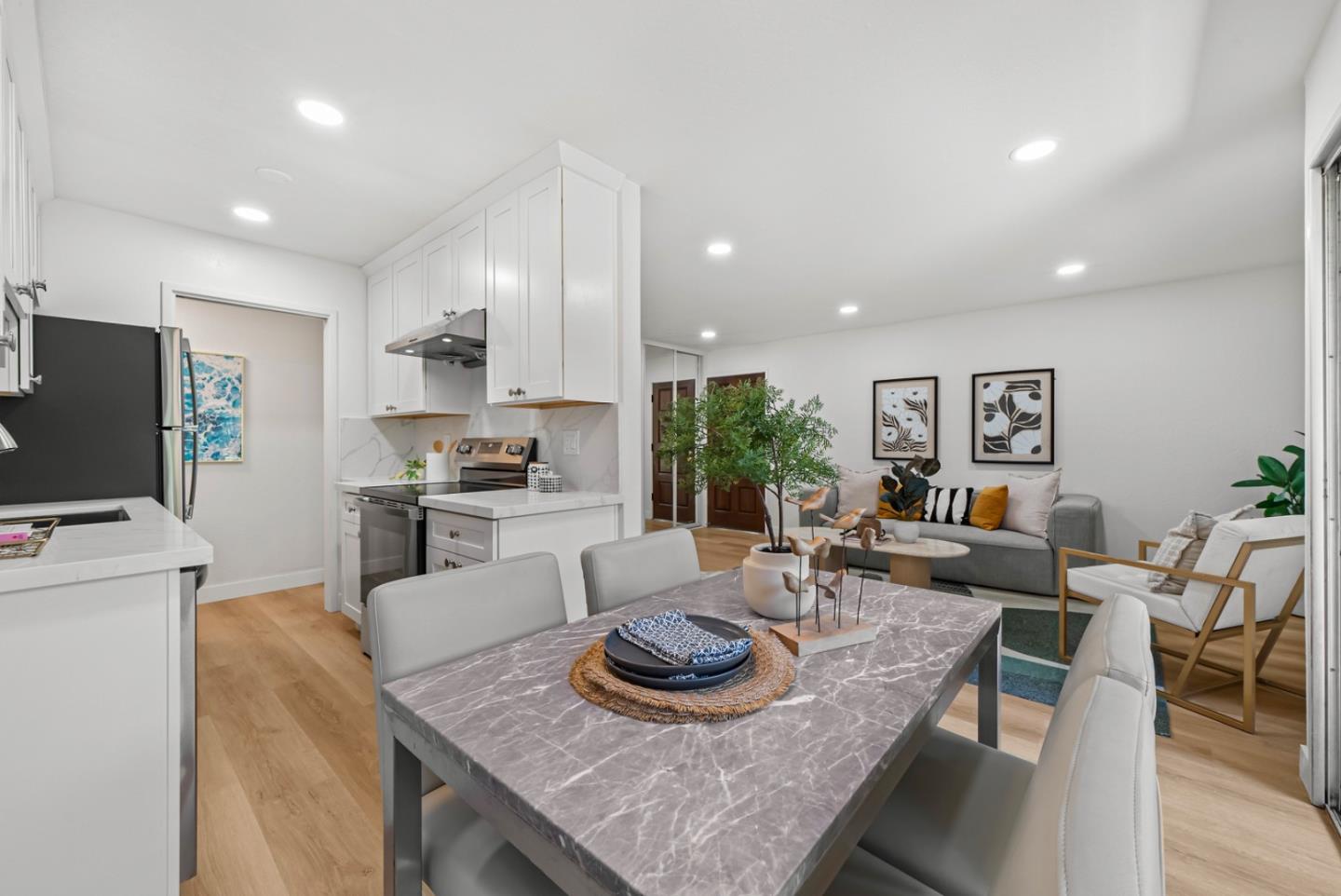 280 Easy Street, Unit 311 Mountain View, CA 94043 - Photo 7 of 29 a kitchen with granite countertop kitchen island stainless steel appliances a table and chairs in it