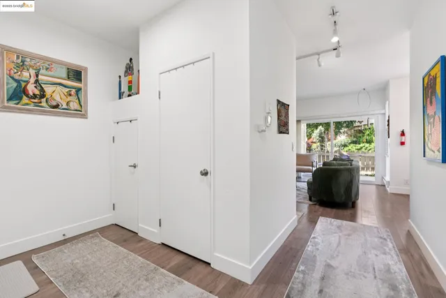 a living room with a bed furniture and a window