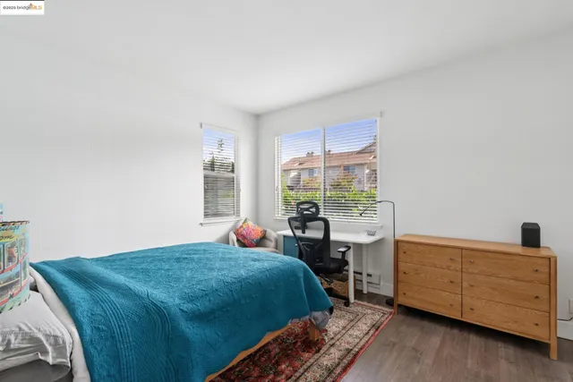 a bedroom with furniture and a window