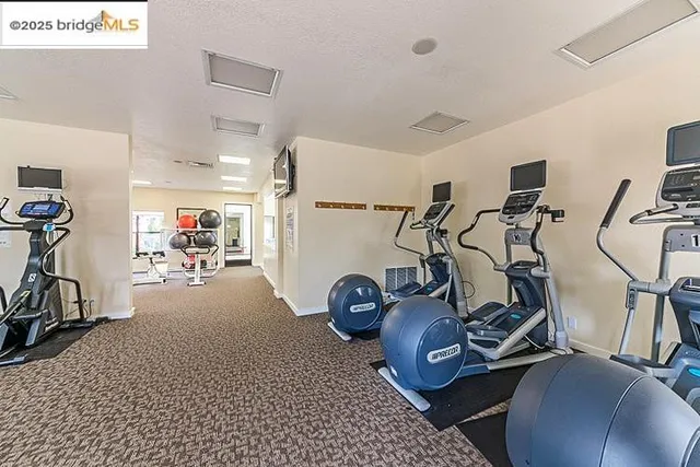 a view of a swimming pool with sitting area