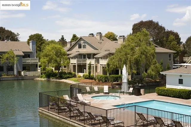 a view of a swimming pool with lounge chairs