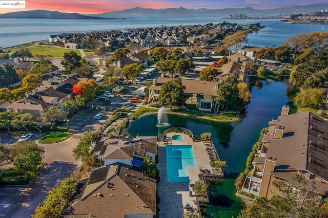 a view of a roof deck with chair and table