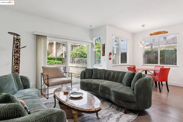 a view of a dining room with furniture and windows