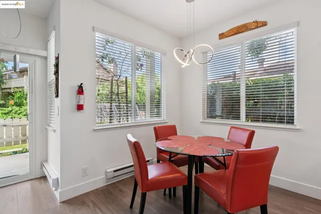 a view of a dining room with furniture and window