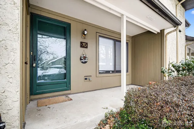 a view of a front door and a window